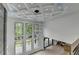 Bright foyer with large windows and modern chandelier at 165 Westbrook St, Buford, GA 30518