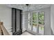 Bright open foyer with large windows, fireplace, and unique chandelier at 165 Westbrook St, Buford, GA 30518