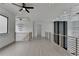 Hallway with modern railing, ceiling fan, and coffered ceilings at 165 Westbrook St, Buford, GA 30518
