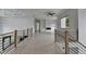 Second floor hallway with modern railing and ceiling fan at 165 Westbrook St, Buford, GA 30518