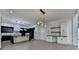 Modern kitchen boasts an island with elegant countertops, state-of-the-art appliances, and ample cabinet space at 165 Westbrook St, Buford, GA 30518