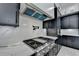 Modern kitchen with stainless steel appliances, white countertops and range hood at 165 Westbrook St, Buford, GA 30518