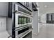 Built-in stainless steel oven and microwave appliances in a modern kitchen at 165 Westbrook St, Buford, GA 30518