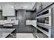 Modern kitchen showcases sleek cabinetry, stainless steel appliances, and elegant countertops at 165 Westbrook St, Buford, GA 30518