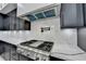 Modern kitchen with stainless steel appliances, white countertops and range hood at 165 Westbrook St, Buford, GA 30518
