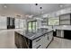 Spacious kitchen featuring a large island and modern, open-concept design at 165 Westbrook St, Buford, GA 30518