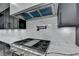 Modern kitchen with stainless steel appliances, white countertops and range hood at 165 Westbrook St, Buford, GA 30518