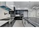 Modern kitchen with stainless steel appliances, sleek countertops, and contemporary lighting at 165 Westbrook St, Buford, GA 30518