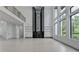 Expansive living room showcasing tall ceilings, a statement fireplace, and abundant natural light at 165 Westbrook St, Buford, GA 30518