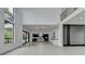 Bright living area boasts an open floor plan with views of the modern kitchen and second-story loft at 165 Westbrook St, Buford, GA 30518