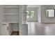 Open living space featuring built-in desk, storage, bright light, and durable flooring at 165 Westbrook St, Buford, GA 30518