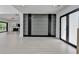 Open-concept space with sleek floors, modern lighting, and a view of the kitchen at 165 Westbrook St, Buford, GA 30518