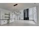 This living room features modern decor, sleek built-in shelving, and transitions into the kitchen at 165 Westbrook St, Buford, GA 30518