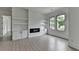 Bright and airy living room with fireplace and custom shelving at 165 Westbrook St, Buford, GA 30518