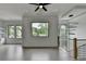 Upstairs loft connecting the home with great lighting and scenic window views for an open, airy feel at 165 Westbrook St, Buford, GA 30518