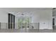 Loft space showcasing the decorative ceiling, pendant lighting, tall window views and modern staircase at 165 Westbrook St, Buford, GA 30518