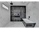 Luxurious shower featuring black and white marble tiling, rain shower head, and a built-in bench at 165 Westbrook St, Buford, GA 30518