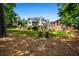 Professionally landscaped backyard with Adirondack chairs overlooking lawn at 3013 Walker Hill Way, Marietta, GA 30064
