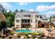 Rear exterior shows in-ground pool, and outdoor living spaces at 3013 Walker Hill Way, Marietta, GA 30064