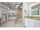 Bright bathroom with large glass shower, granite countertops, and well-lit vanity areas at 3013 Walker Hill Way, Marietta, GA 30064