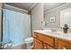 Stylish bathroom featuring a patterned shower curtain, classic vanity, and neutral wall color at 3013 Walker Hill Way, Marietta, GA 30064
