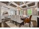 Elegant dining room featuring dark wood table, chandelier, and large windows with shutters at 3013 Walker Hill Way, Marietta, GA 30064
