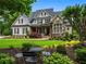 Charming home with stone and siding, a manicured lawn and established landscaping at 3013 Walker Hill Way, Marietta, GA 30064