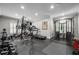 Well-equipped home gym featuring weightlifting machines, treadmill, and rubber flooring at 3013 Walker Hill Way, Marietta, GA 30064