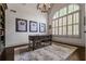 Well-lit office space featuring a rustic desk, built-in shelves, and a large window at 3013 Walker Hill Way, Marietta, GA 30064