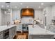 Gourmet kitchen with stainless steel appliances, double islands, and custom range hood at 3013 Walker Hill Way, Marietta, GA 30064