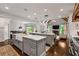 Spacious, open kitchen with double islands flowing to the living room with fireplace at 3013 Walker Hill Way, Marietta, GA 30064