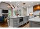 Open concept kitchen with marble countertops, seating, and views to the living room at 3013 Walker Hill Way, Marietta, GA 30064