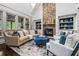 Inviting living room with stone fireplace, plush seating, and large windows at 3013 Walker Hill Way, Marietta, GA 30064