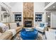 Bright living room with a stone fireplace, built-in shelves, and comfortable seating at 3013 Walker Hill Way, Marietta, GA 30064