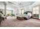 Bright main bedroom with trey ceilings, a sitting area, and plush carpet at 3013 Walker Hill Way, Marietta, GA 30064