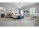 Spacious main bedroom with a chandelier, sitting area, and ensuite bathroom, offers comfort and style at 3013 Walker Hill Way, Marietta, GA 30064
