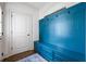 Charming mudroom with a custom blue built-in bench and storage at 3013 Walker Hill Way, Marietta, GA 30064