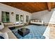 Covered patio with ceiling lights, porch swing, seating area, and outdoor decor at 3013 Walker Hill Way, Marietta, GA 30064