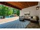 Covered patio with wooded ceiling overlooks the backyard oasis with pool and slide at 3013 Walker Hill Way, Marietta, GA 30064