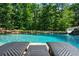 Resort-style pool features a slide, waterfall features, and lounge chairs for ultimate relaxation at 3013 Walker Hill Way, Marietta, GA 30064