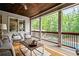 Inviting screened porch featuring wicker furniture and a view of the backyard pool at 3013 Walker Hill Way, Marietta, GA 30064