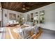 Relaxing screened porch with a porch swing, wicker chairs and a wooden ceiling at 3013 Walker Hill Way, Marietta, GA 30064