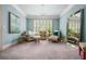 Cozy sitting area with soft, muted blues and neutral tones, and lots of natural light at 3013 Walker Hill Way, Marietta, GA 30064