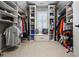 Organized walk-in closet with custom shelves, drawers, and bench seating at 3013 Walker Hill Way, Marietta, GA 30064