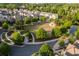 High angle view of manicured green space with a gazebo and mature trees lining neighborhood streets and sidewalks at 3380 Labrouste Cv, Duluth, GA 30097