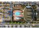 Overhead view of community pool, playground and green space surrounded by beautifully landscaped streets and residences at 3380 Labrouste Cv, Duluth, GA 30097