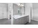 Bathroom boasts a stylish vanity with stone countertops and modern finishes at 3380 Labrouste Cv, Duluth, GA 30097