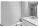 Bathroom with marble countertop, tile floor, and shower at 3380 Labrouste Cv, Duluth, GA 30097