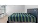 Bedroom featuring carpet, bright window, and blue accents at 3380 Labrouste Cv, Duluth, GA 30097