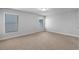 Bright bedroom with neutral carpet, and windows that provide plenty of natural light at 3380 Labrouste Cv, Duluth, GA 30097